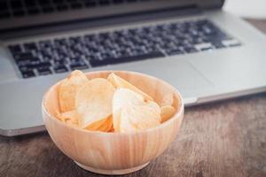Crispy potato chips on a workstation