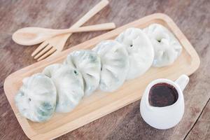 Dim sum on a wooden tray photo