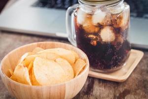 Potato chips with an iced cola photo