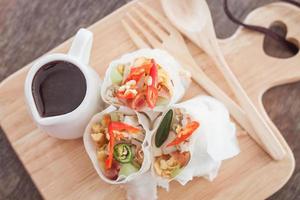 Top view of spring rolls on a cutting board photo