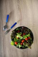 Fresh salad with vegetables and greens photo