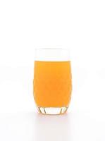 Glass of orange juice on white background photo