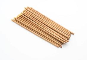 Bamboo chopsticks on white background photo
