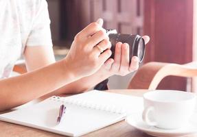 Woman with a camera in her hands photo