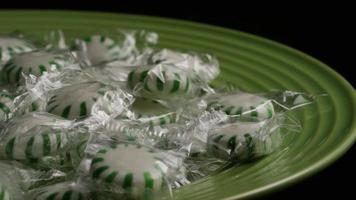 Rotating shot of spearmint hard candies - CANDY SPEARMINT 014 video