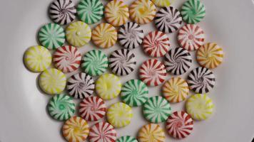 Rotating shot of a colorful mix of various hard candies - CANDY MIXED 001 video