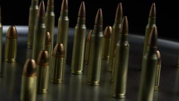 Cinematic rotating shot of bullets on a metallic surface - BULLETS 073 video