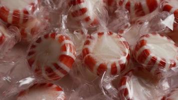 Rotating shot of peppermint candies - CANDY PEPPERMINT 011 video