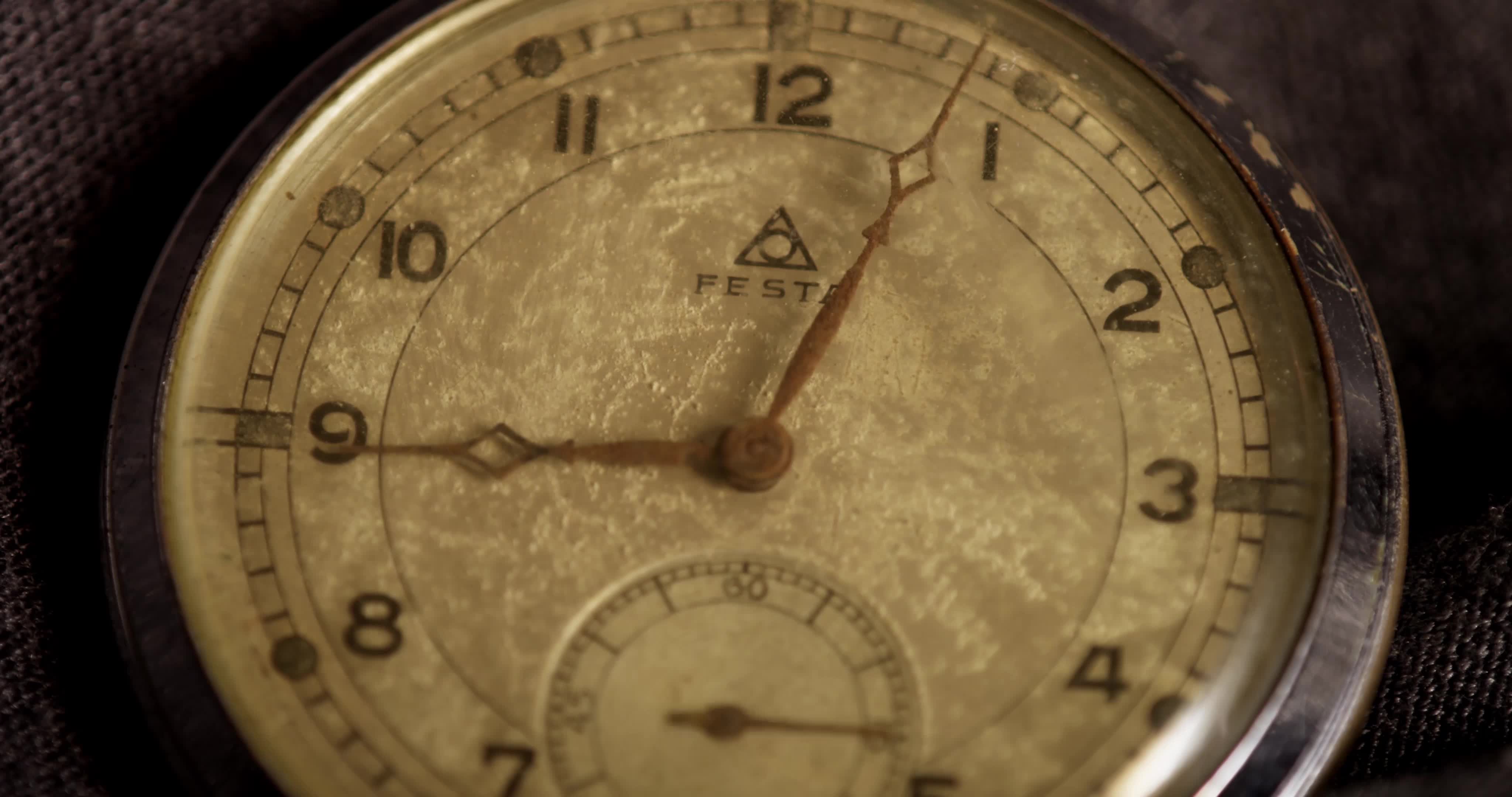 Extreme close up shot of clock hands moving from 858 to 1049 in 4K