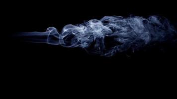 Dark background with smoke with horizontal path and beautiful swirls in 4K video