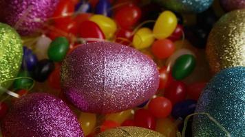 Rotating shot of Easter decorations and candy in colorful Easter grass - EASTER 021 video