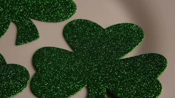 Rotating stock footage shot of St Patty's Day clovers on a white surface - ST PATTYS 006