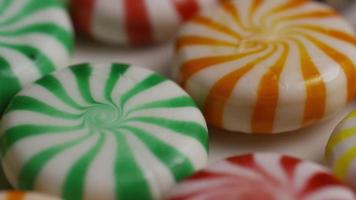 Rotating shot of a colorful mix of various hard candies - CANDY MIXED 020 video
