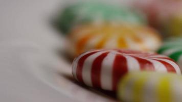 Rotating shot of a colorful mix of various hard candies - CANDY MIXED 035 video