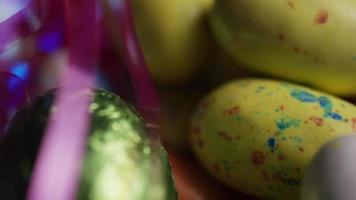 Rotating shot of colorful Easter candies on a bed of easter grass - EASTER 182 video