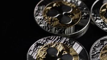 Rotating shot of Bitcoins digital cryptocurrency - BITCOIN RIPPLE 0092 video