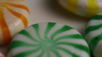 Rotating shot of a colorful mix of various hard candies - CANDY MIXED 025 video