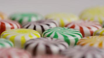 Rotating shot of a colorful mix of various hard candies - CANDY MIXED 033 video