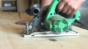 Close up of Hands Using Circular Saw on a Ash Plank video