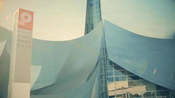 Close up panning shot going down of the entrance stairs of the Walt Disney Concert Hall at Los Angeles in 4K with sun flare. video