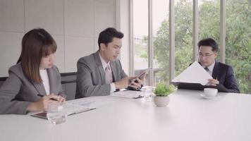 Slow motion - Smart business man and beautiful woman secretary present project by tablet to his boss to approve. Businessman present com. video