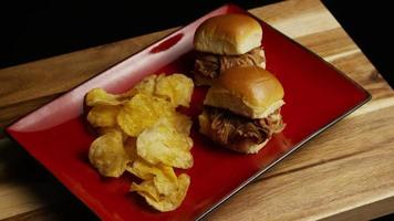 Rotating shot of delicious pulled pork sliders - BBQ 089 video