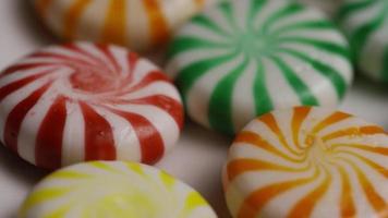 Rotating shot of a colorful mix of various hard candies - CANDY MIXED 021 video