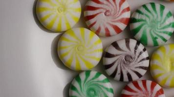 Rotating shot of a colorful mix of various hard candies - CANDY MIXED 005 video