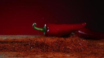 Peppers falling and bouncing in ultra slow motion 1,500 fps on a reflective surface - BOUNCING PEPPERS PHANTOM 015 video