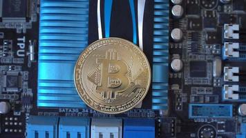 Cryptocurrency mining concept with bitcoins on graphic videocard video