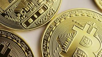Rotating shot of Bitcoins (digital cryptocurrency) - BITCOIN 0158