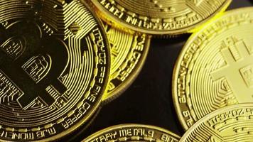 Rotating shot of Bitcoins (digital cryptocurrency) - BITCOIN 0090