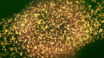 Goldglitter auf grünem Hintergrund in 4k video