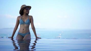 Young Woman Relaxing In A Swimming Pool video