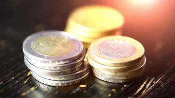 Euro coin on wooden table- financial power concept, closeup dolly shot video