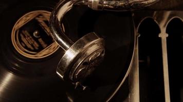  Extreme close up shot top view of old record player, vynil disc on turntable and needle in 4K video