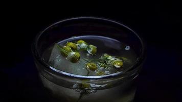 Placing A Frozen Chamomile Flowers In Ice video