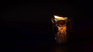 Black Skull Container With Candle Turning Off video