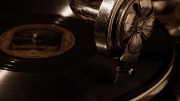 Close up shot of old record player, turntable with vynil disc and reproducer needle in 4K