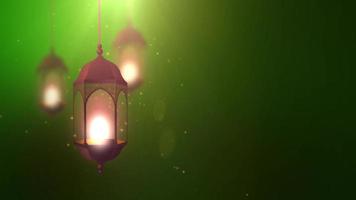 Ramadan candle lantern falling down hanging on string green background video