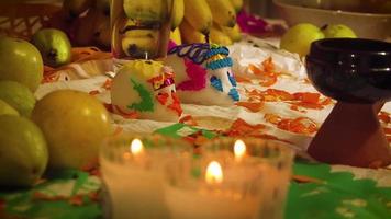 Sugar Skulls And Candles In Mexican Offering