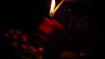 Lighthing A Chiristmas Candle In Darkness video