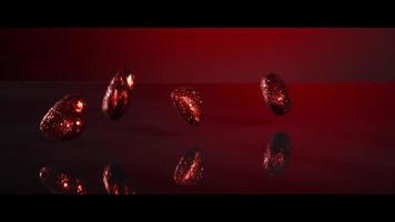 Valentine's Day decorations falling and bouncing on a reflective surface - VALENTINES 010 video