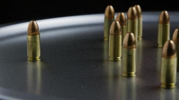 Cinematic rotating shot of bullets on a metallic surface - BULLETS 052 video