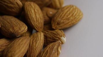 Cinematic, rotating shot of almonds on a white surface - ALMONDS 027 video