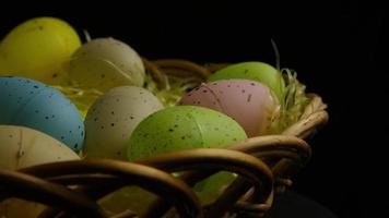 Rotating shot of Easter decorations and candy in colorful Easter grass - EASTER 045 video