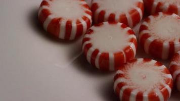 Rotating shot of peppermint candies - CANDY PEPPERMINT 029 video