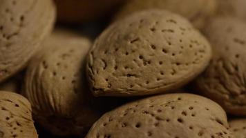 Cinematic, rotating shot of almonds on a white surface - ALMONDS 152 video