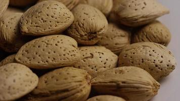 Cinematic, rotating shot of almonds on a white surface - ALMONDS 146 video