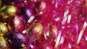 Rotating shot of colorful Easter candies on a bed of easter grass - EASTER 210 video